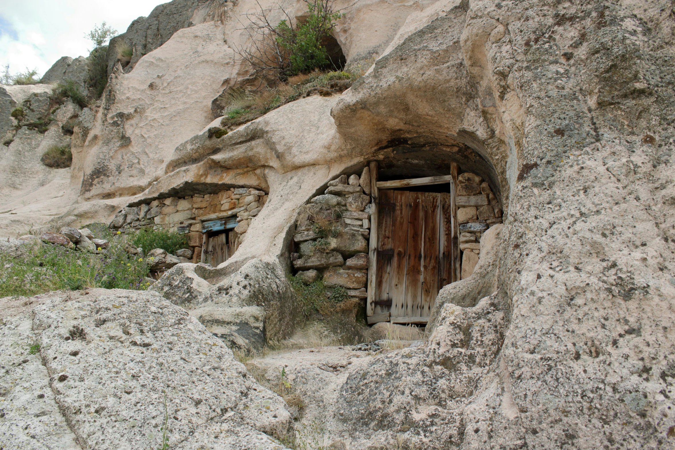 a doorway carved into the side of a rock formation