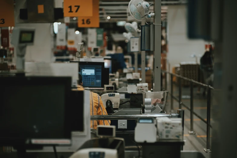 a computer store with a number of computers on the counters