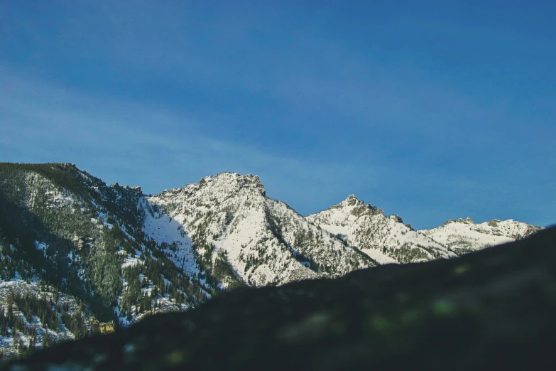 the top of a mountain that has been covered in snow