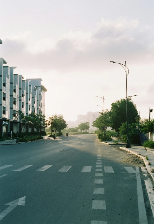 a empty road lined with tall buildings