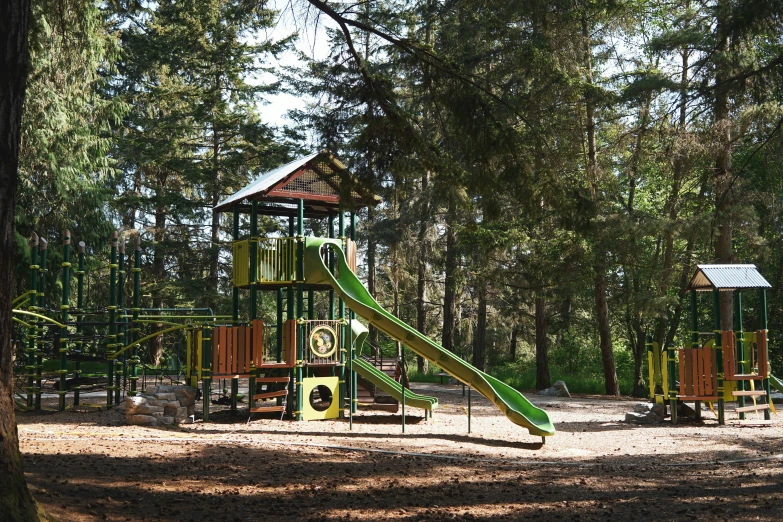 there is a children's play area in the woods