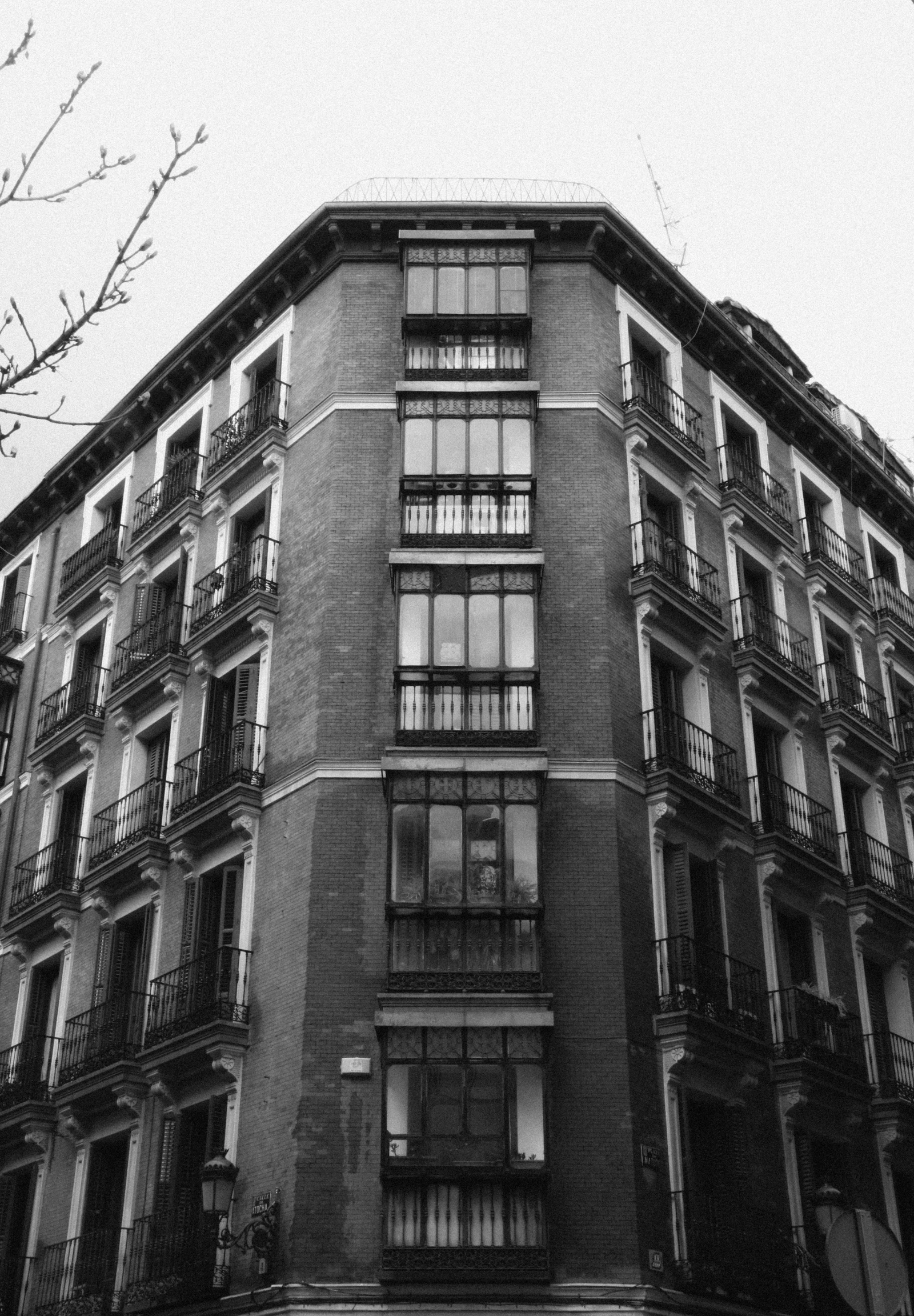 the windows of a building on a street in a city