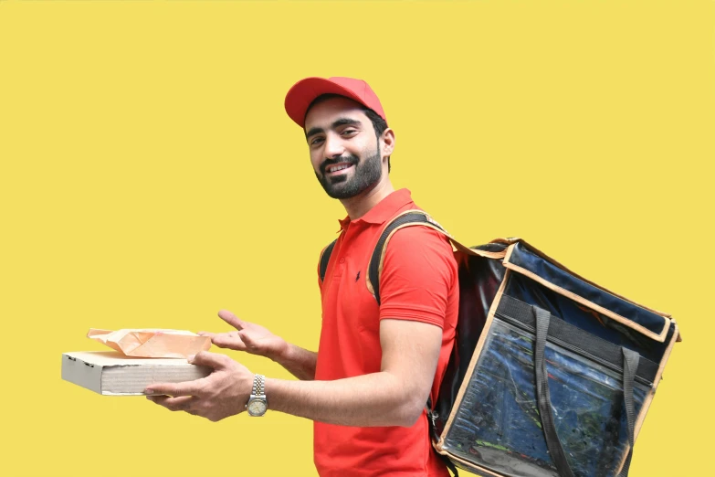 man holding pizza in a box and backpack