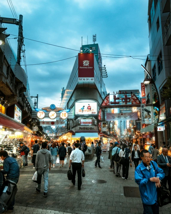 busy downtown area at night with people walking around