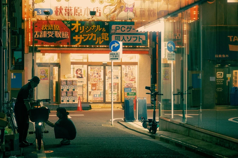 people standing on sidewalk next to buildings at night