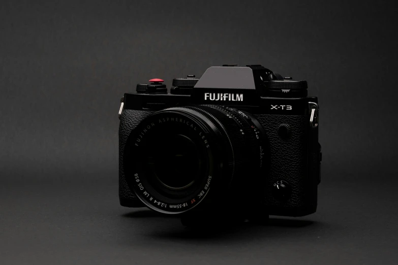 a camera on a grey background with a black background