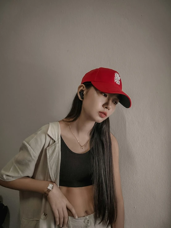 a young woman posing in her red hat