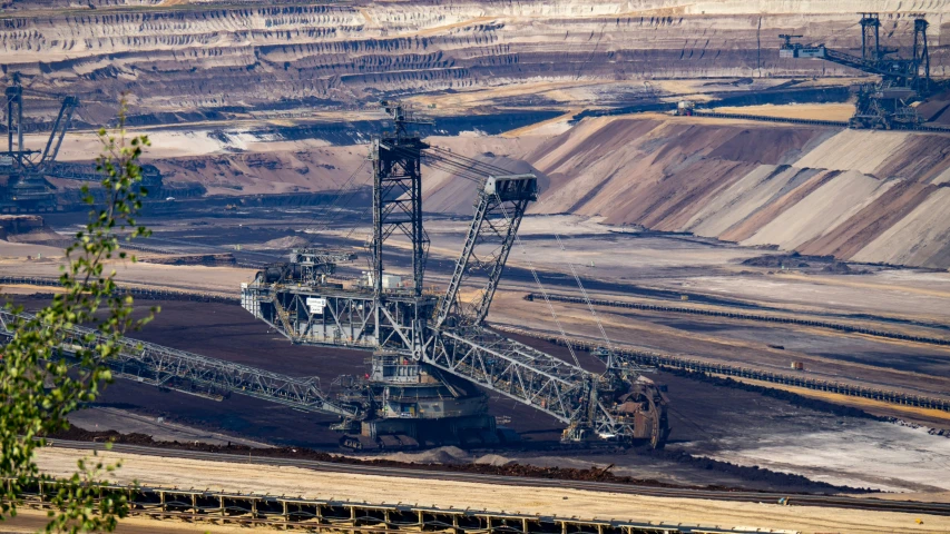 a large crane sitting in a huge open field