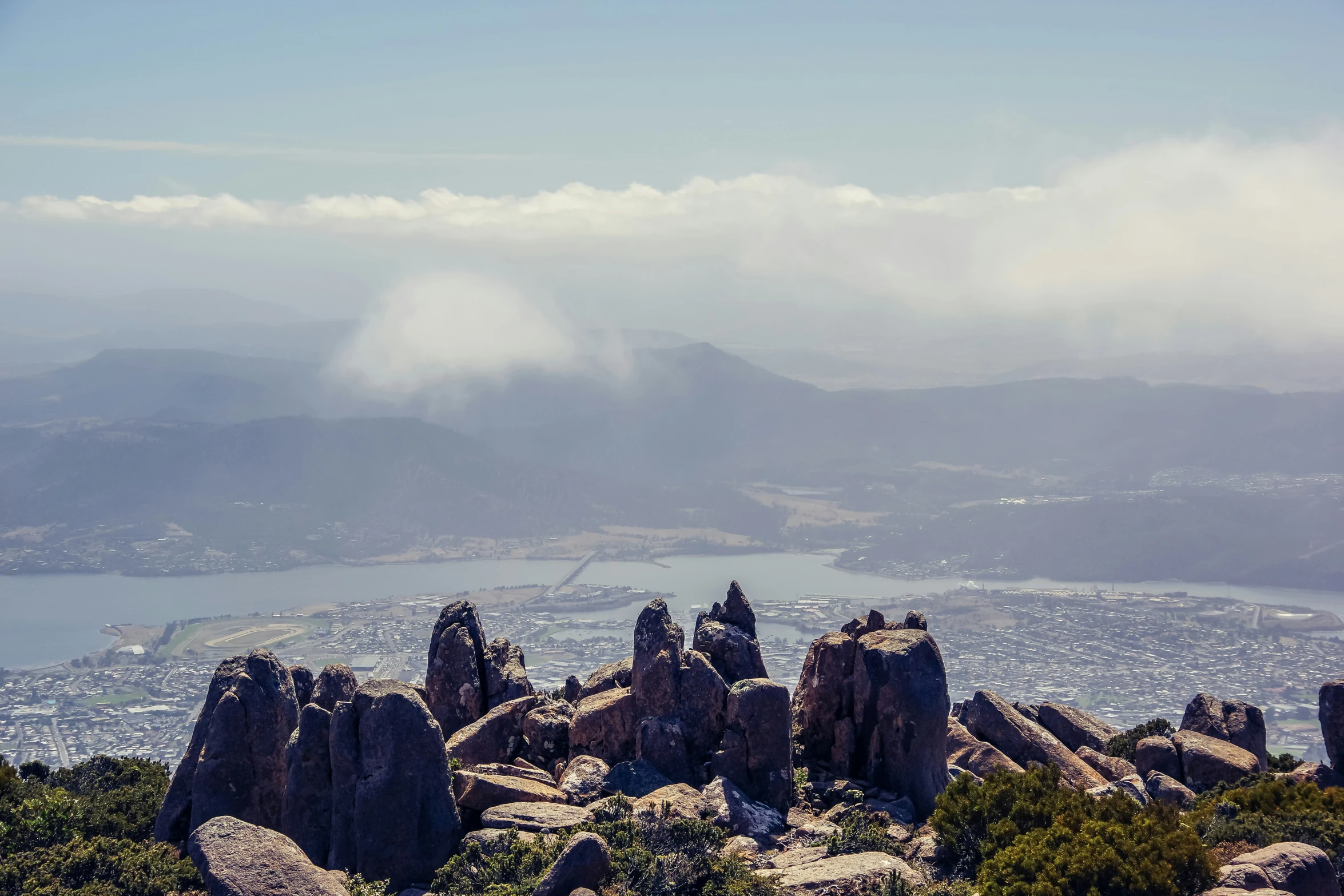 the mountains are covered with rocks that have been rounded by trees