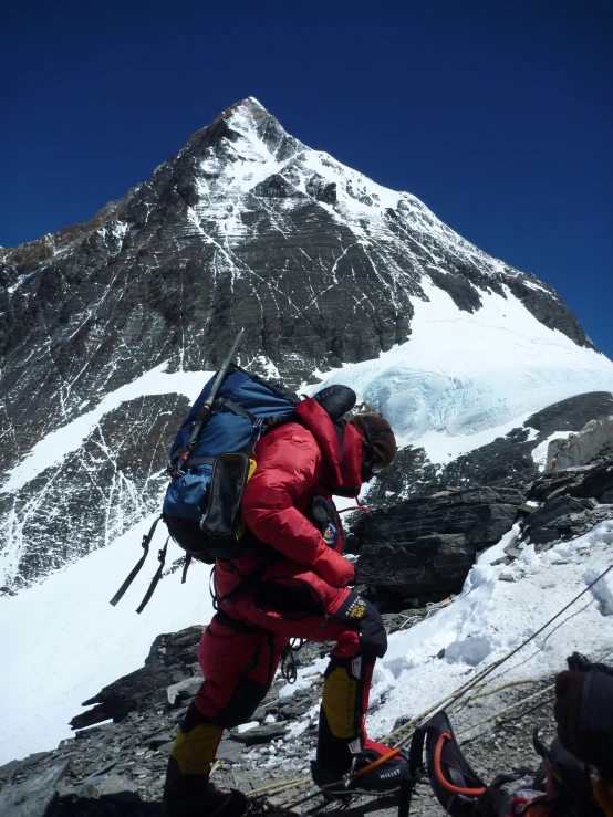 a man standing on a snow covered slope