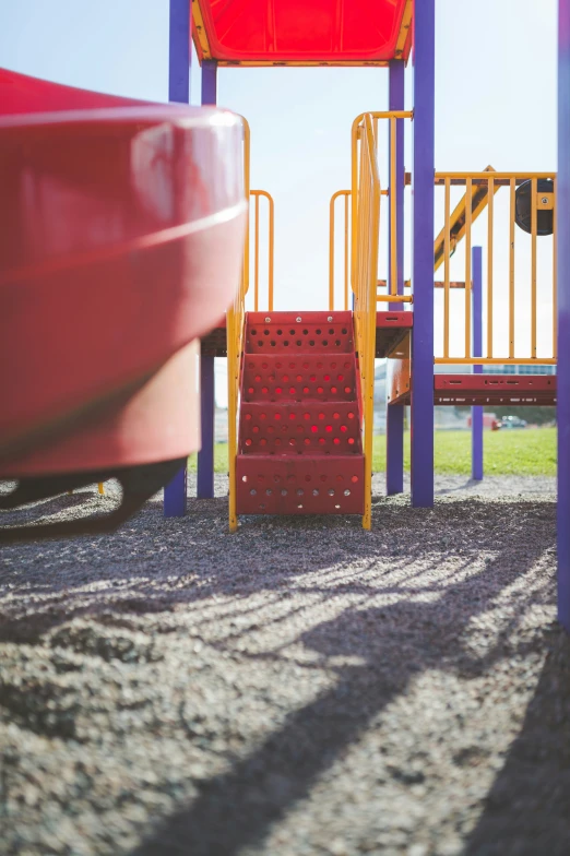 some steps in the sand and two slides