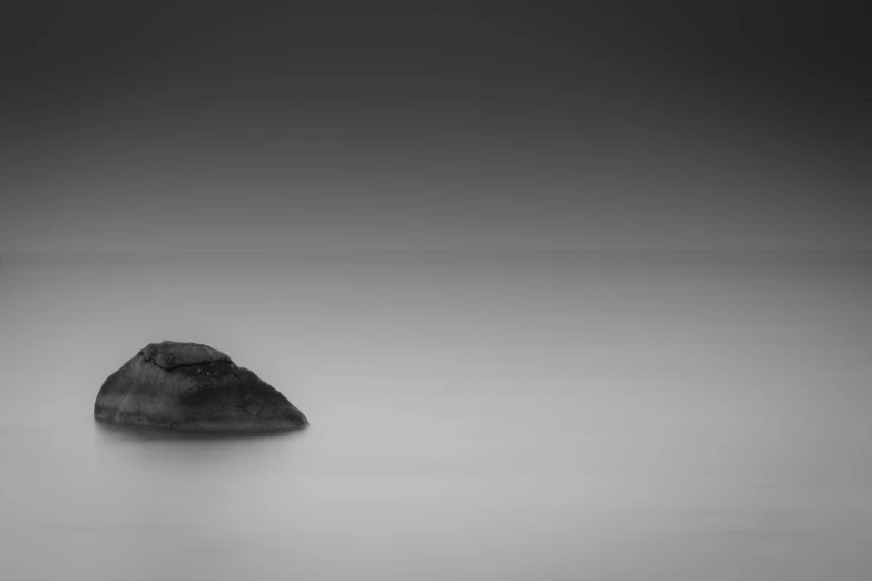 black and white po of rocks in the water