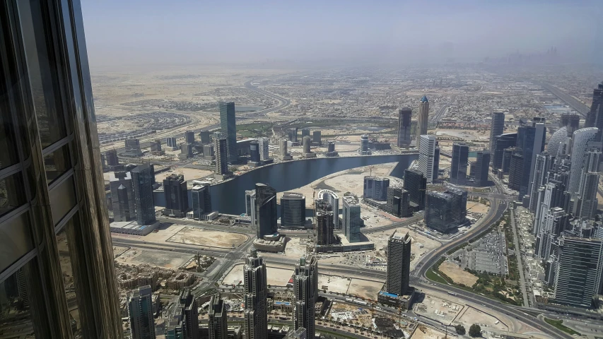 the view from a very large building with a body of water near by