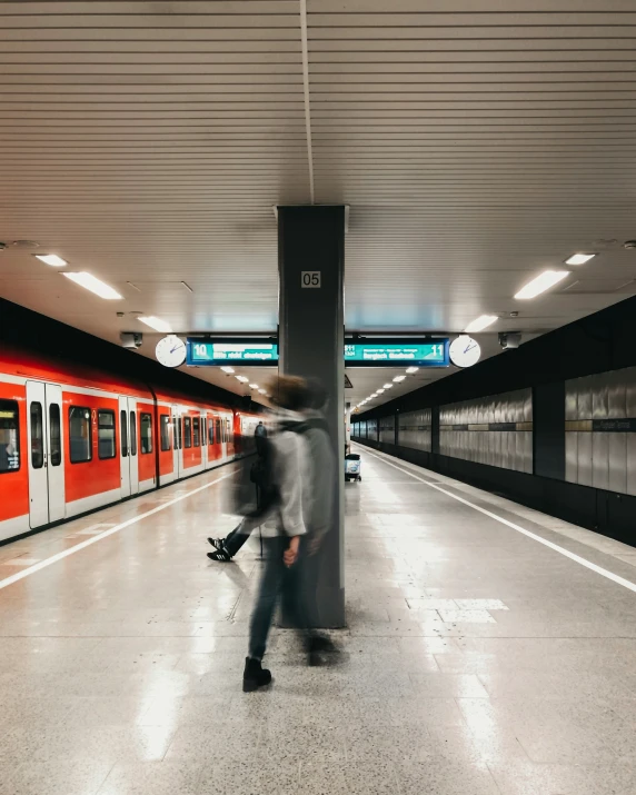 a train pulling up to a subway station platform