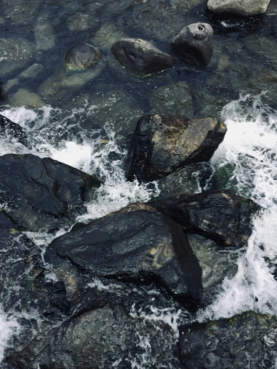 a river flowing into rocks in a rocky area