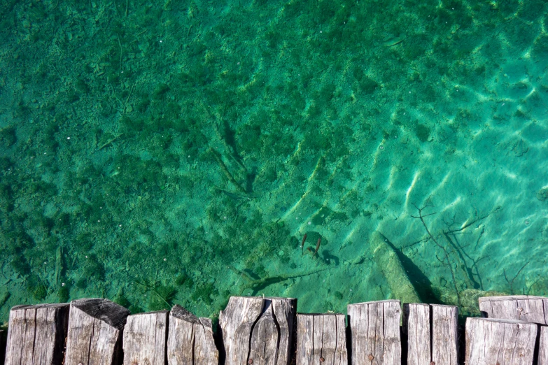 a wood platform that is over looking the water