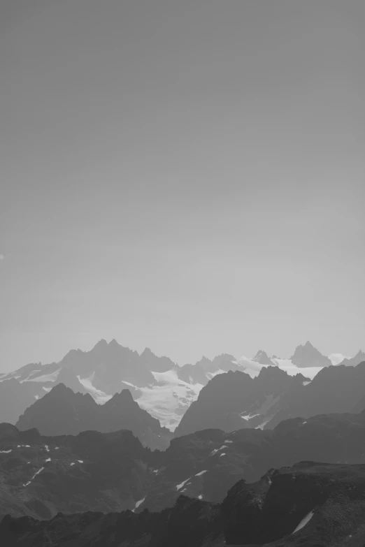 snow covered mountains on a gray and clear day