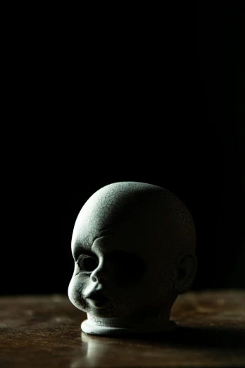 a white skull head sitting on a table
