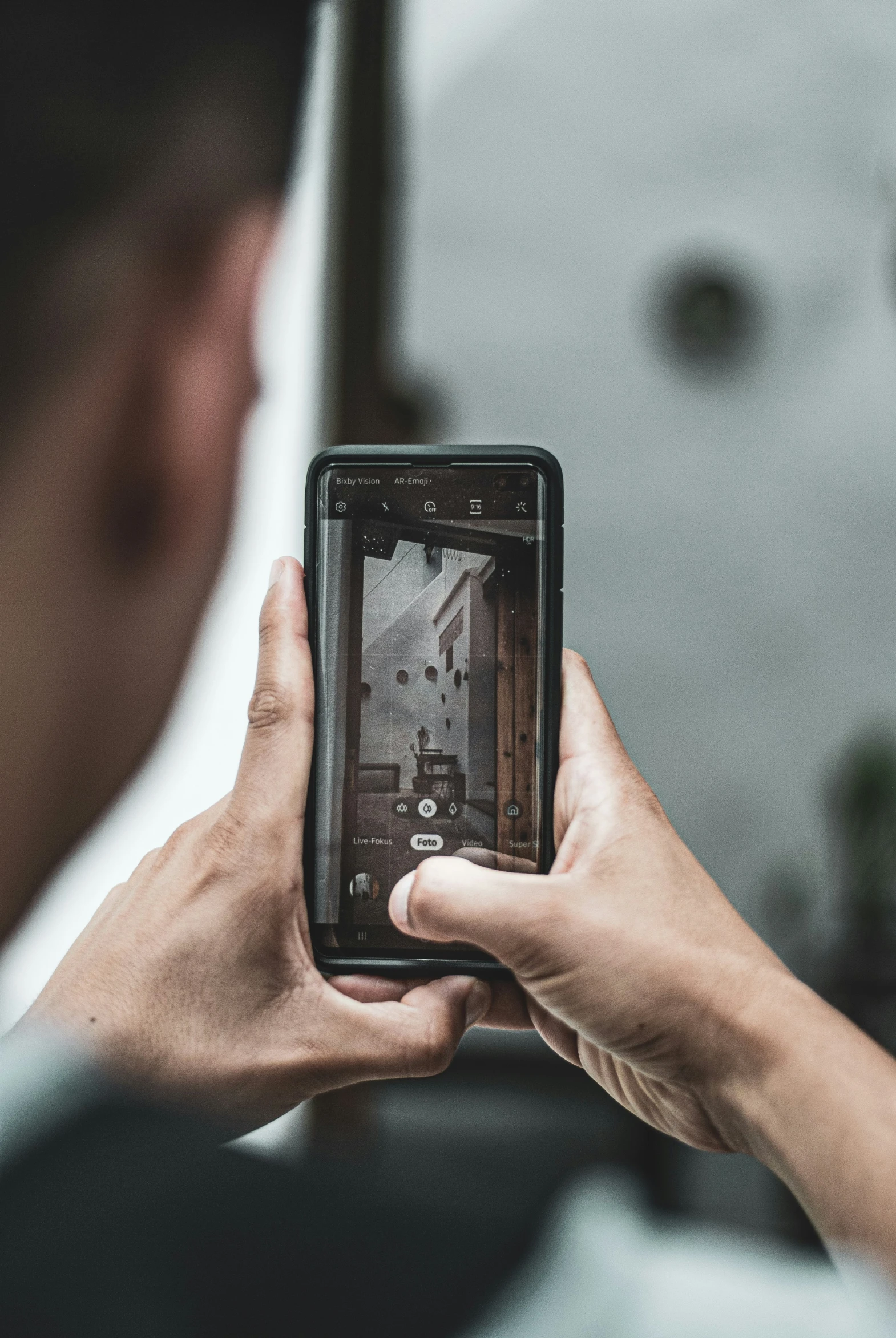 person holding a phone with a picture on it