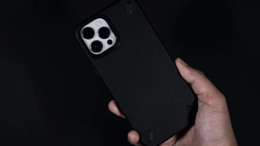 an iphone case in black with white spots