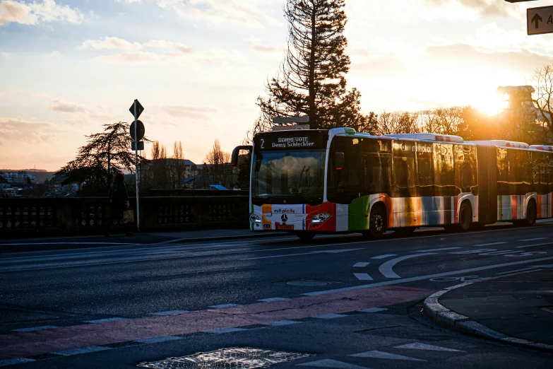 a bus traveling down the road with traffic signs