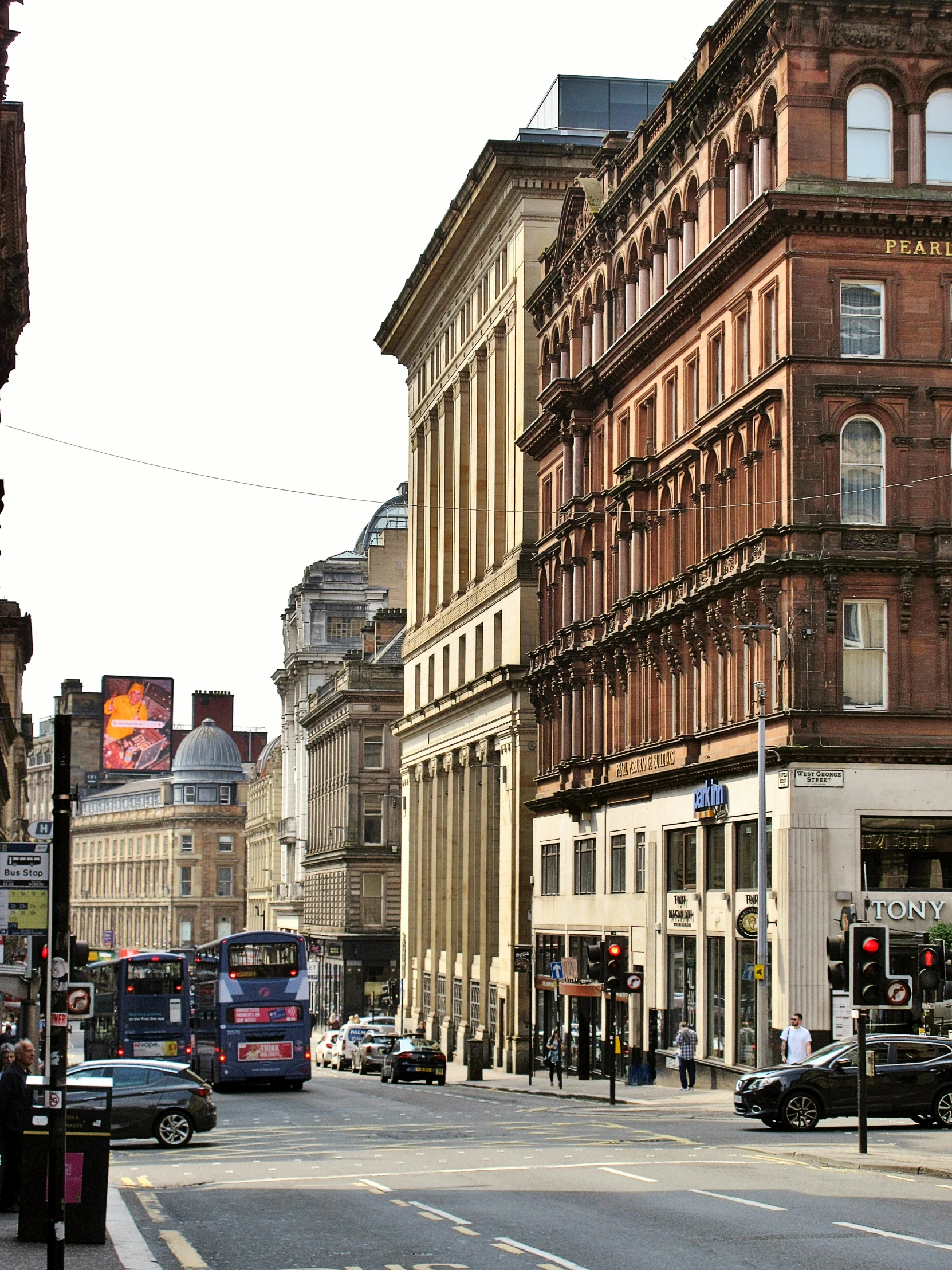 a street with a bunch of tall buildings on either side