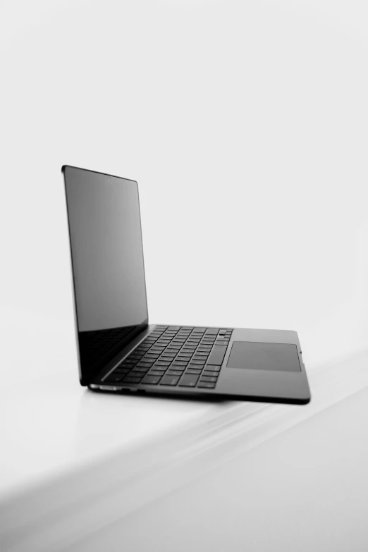 a black laptop computer with silver accents