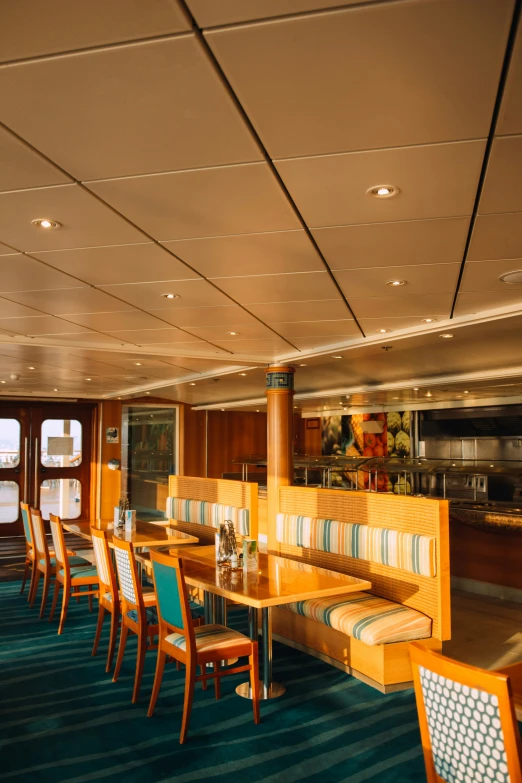 the interior of a boat dining table next to another row of tables