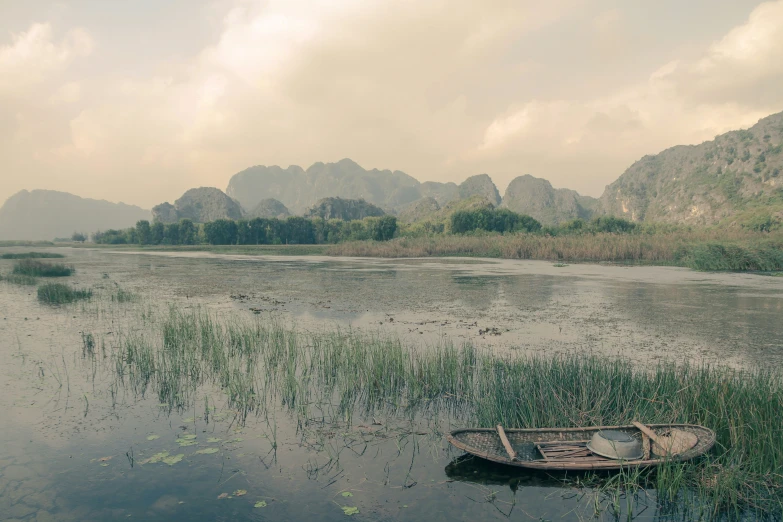 a empty boat in a small body of water