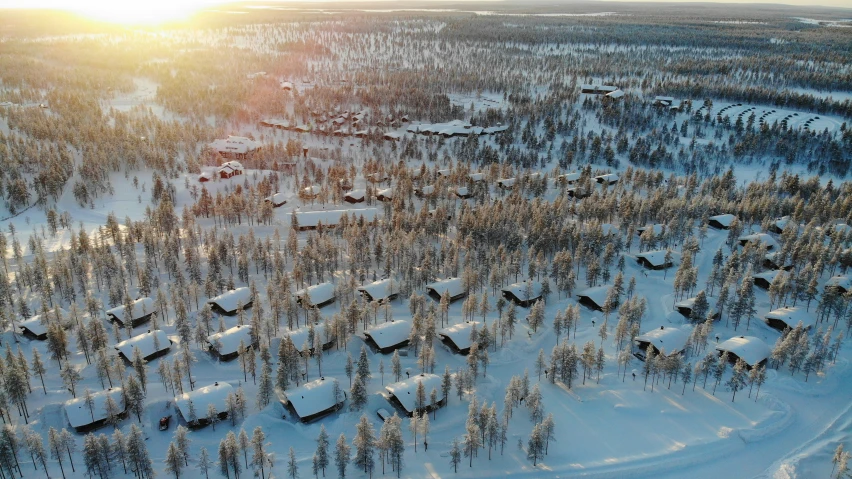 a ski lodge in the woods is surrounded by snow