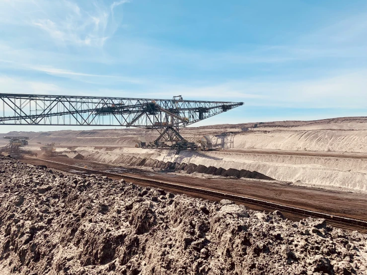 an aerial view of a train track near sand