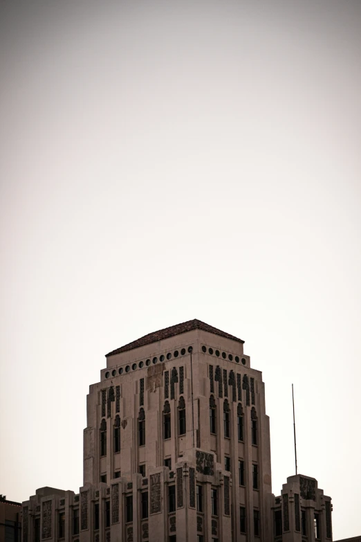 the old building has three windows and a steeple