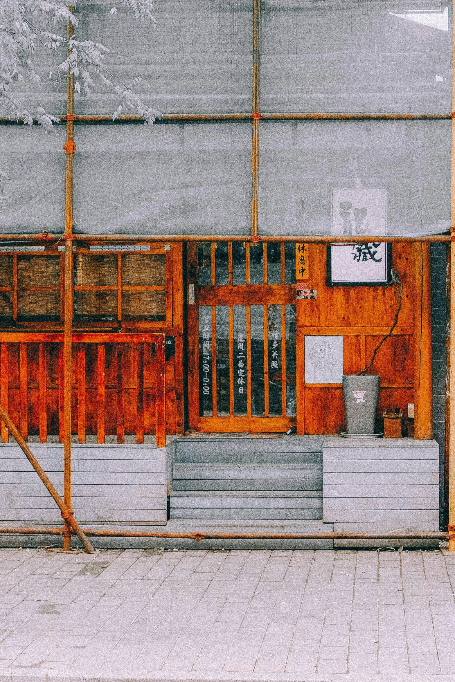 an old building with multiple windows and a fire hydrant next to it