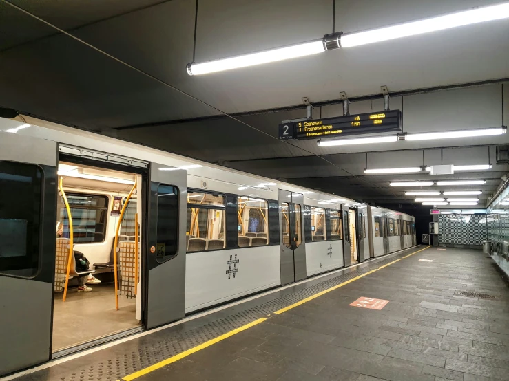 a subway car is pulling into the station for passengers