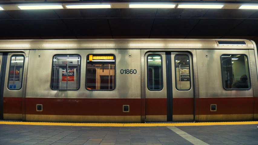 a very big pretty train at the station