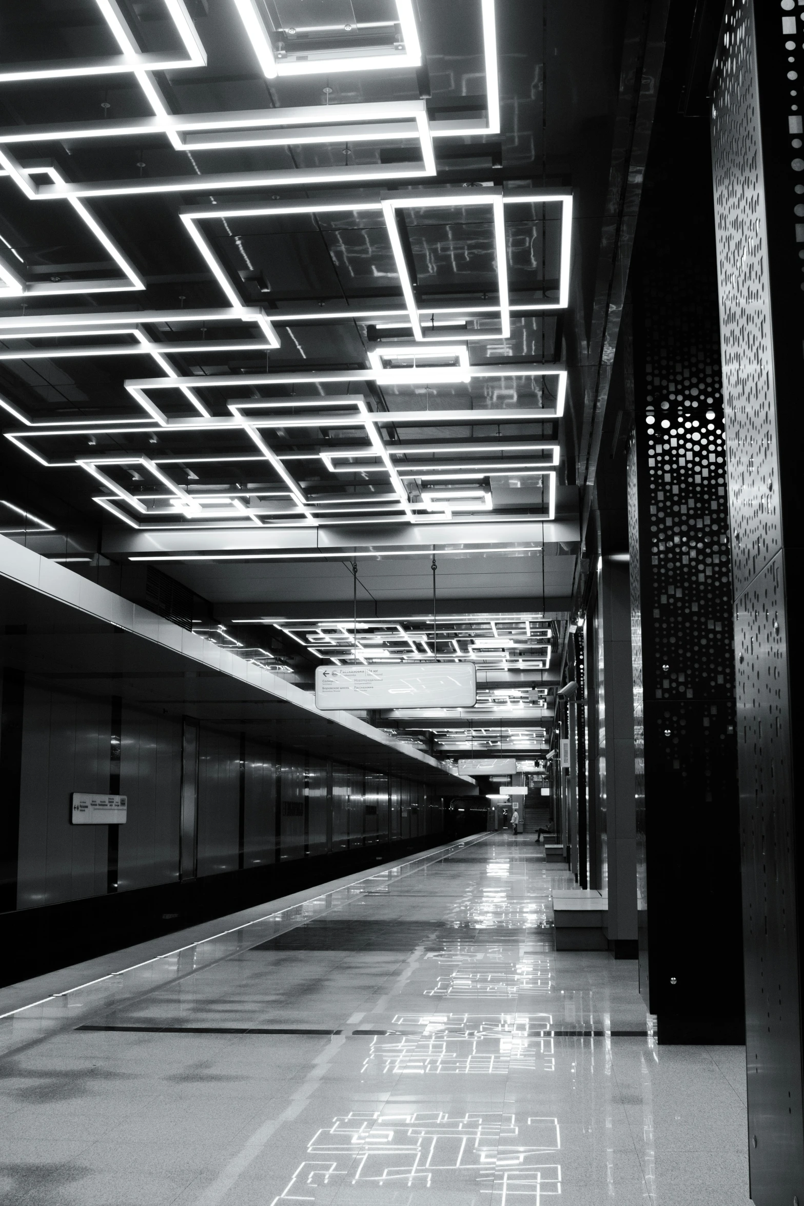 black and white po of an empty subway station