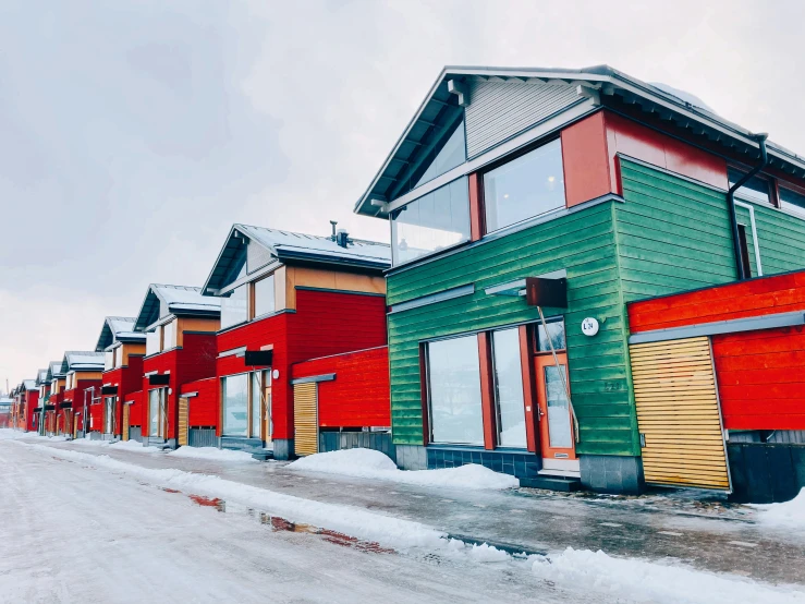 this colorful row houses in winter have snow