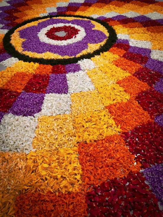 colorful petals on top of flowers are arranged in the shape of a circle