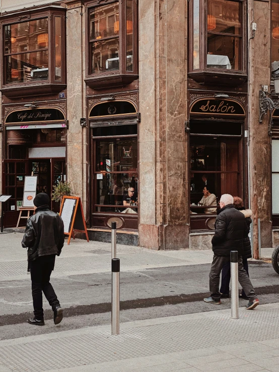 a group of people that are standing in front of buildings