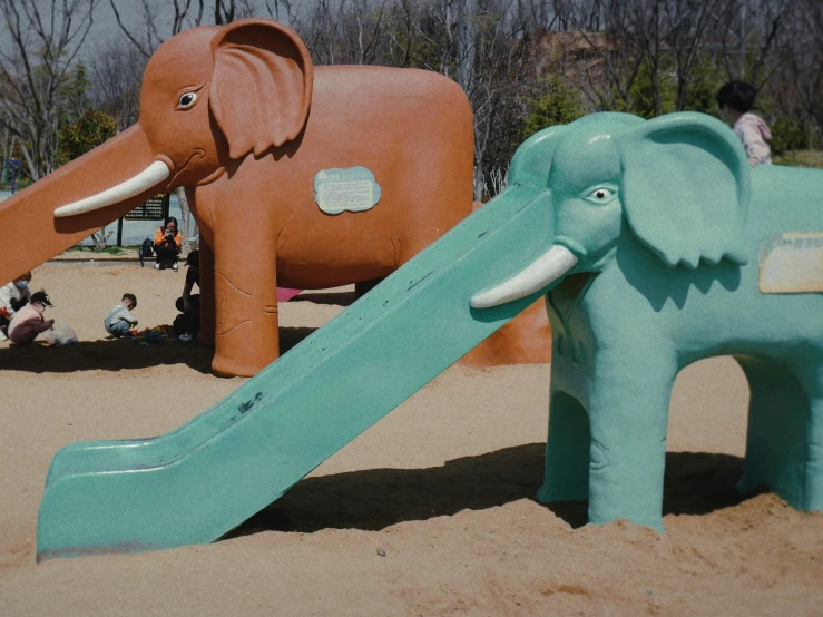 there are many fake elephants in the sand