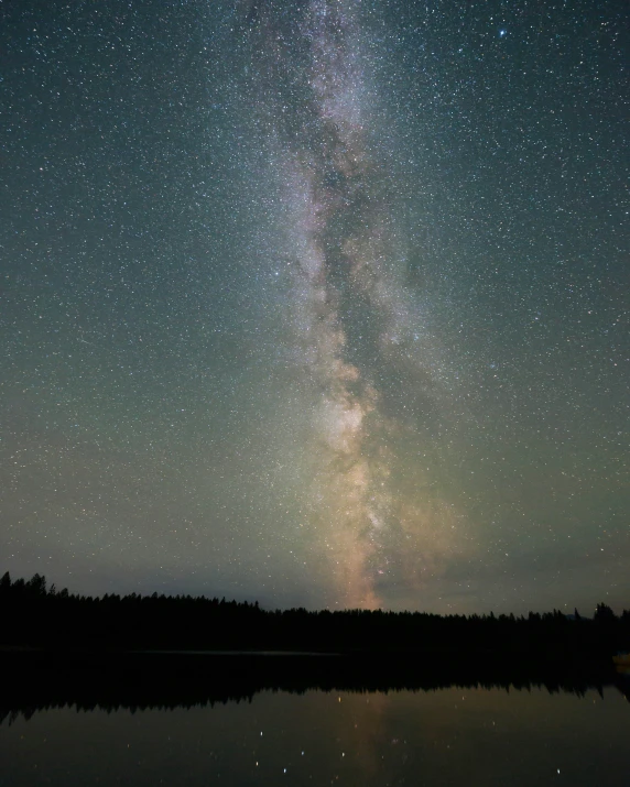 some sky with some stars and a calm water