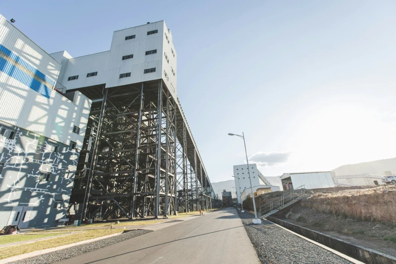 the walkway leads to a tall building that has been constructed into it