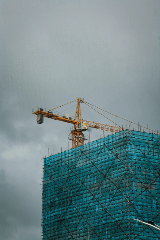 a large crane is on top of a building