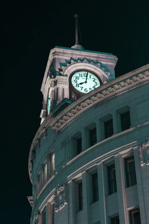 a tall clock tower lit up at night