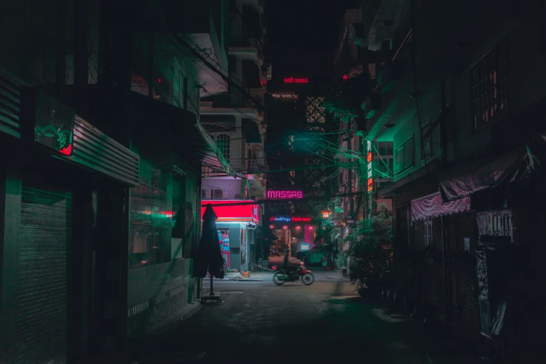 dark alley with green and red lights at night