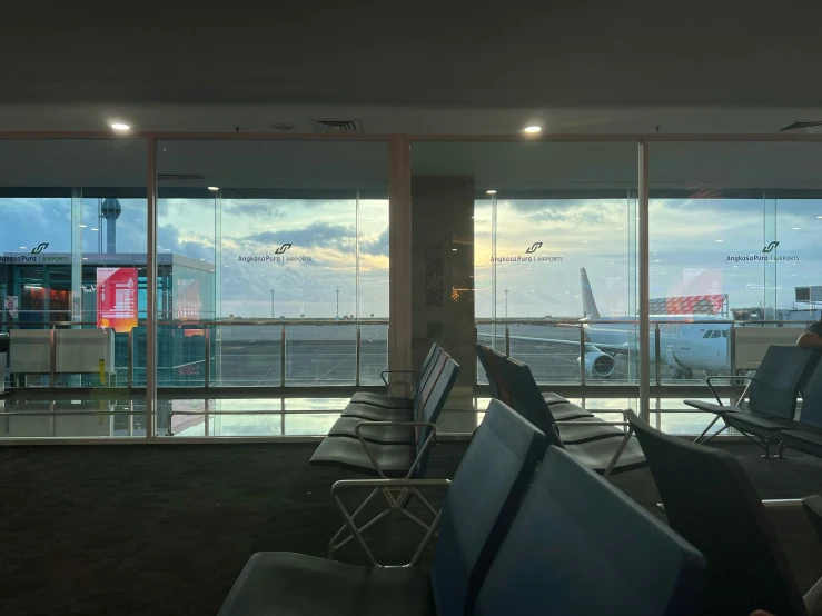 a view of an airplane wing through glass