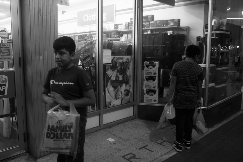 a man in a black and white po is carrying bags