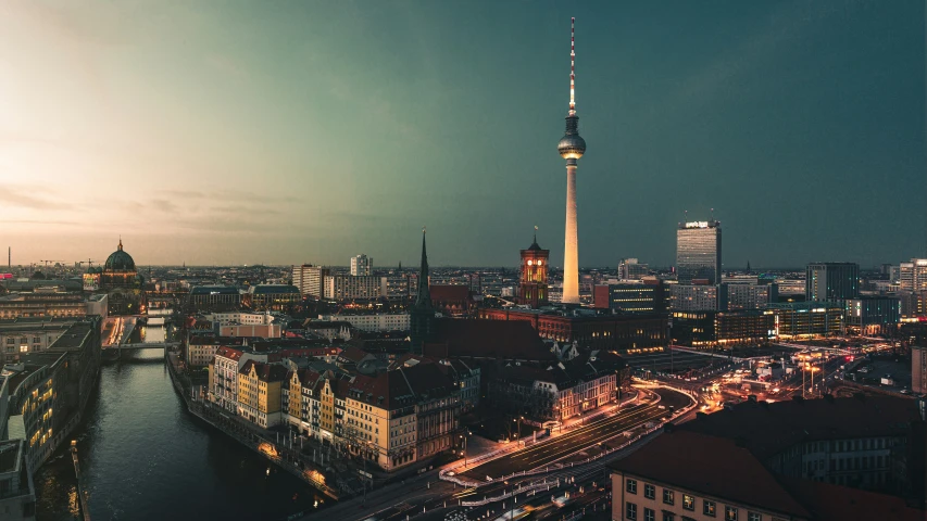 an aerial view of berlin and the spreet river at dusk