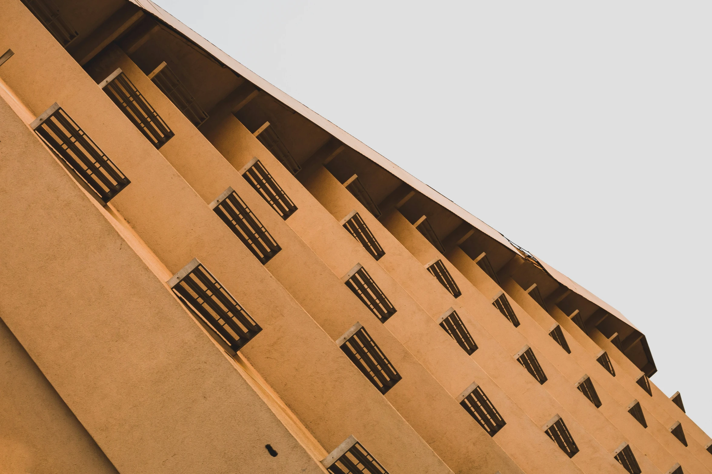 an image of a tall building that has four windows