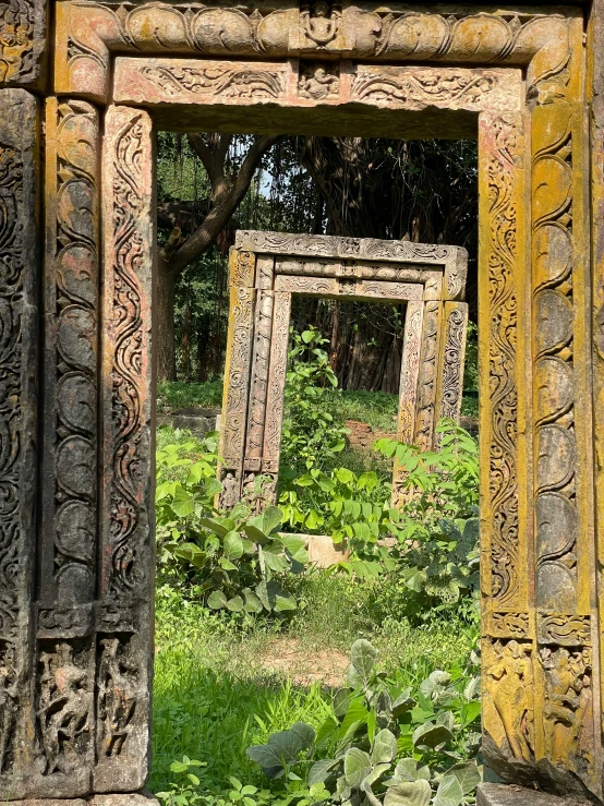 the image of an intricate sculpture is shown through the door frame